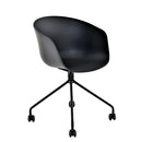 HAY black tub chair with castors, polypropylene seat and steel legs. MAD CHAIR COMPANY
